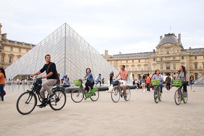 First Day Bike Tour, Top Sights, hidden gems, Wine&Cheese picnic - A small-group bike loop that helps you read Paris