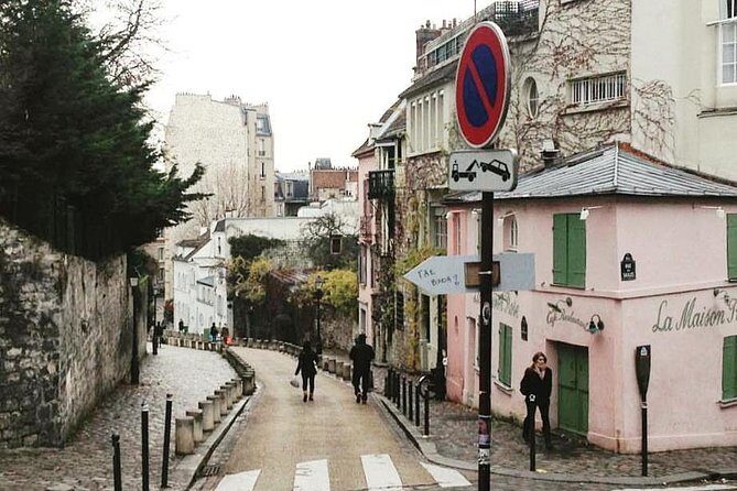 Montmartre & Sacré Coeur Private Historical 2-Hour Walking Tour in Paris - Moulin Rouge: A Quick Peek That Sets the Mood
