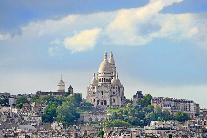Montmartre’s heritage with specialties tasting Private Tour - Rue des Martyrs food tasting: croissants, jam, and cheese that keep the walk fun