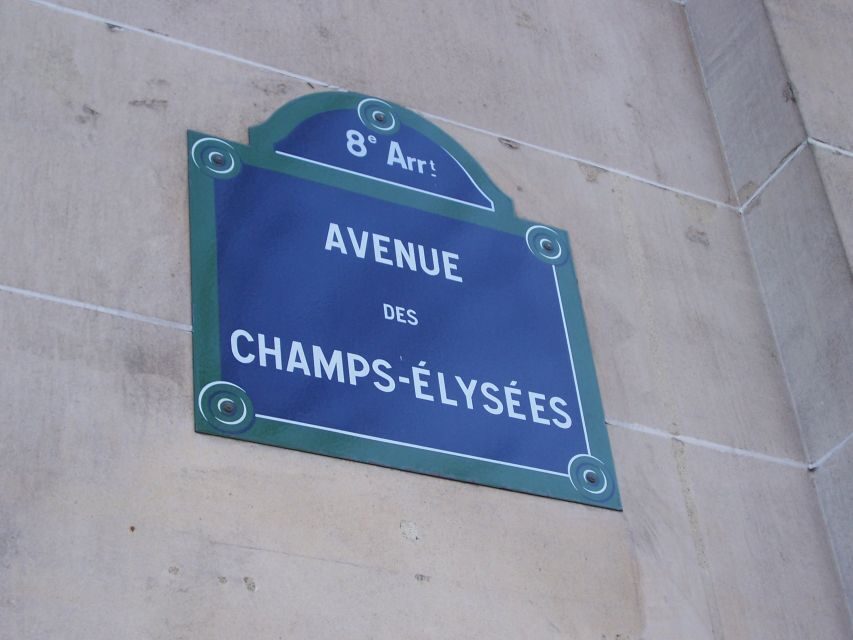 Paris: Arc de Triomphe Entry and Walking Tour - Champs-Élysées at eye level: stories, parades, and movie-star energy