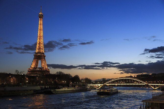 Paris By Night with Seine River Cruise and Roundtrip Luxury Transportation - Seine River Cruise on Bateaux Parisiens: Glass-Covered Views Without the Chill
