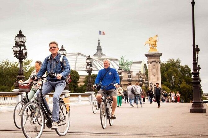Paris: City Bike Tour on a Dutch Bike - Louvre exterior and Notre-Dame from the bike saddle