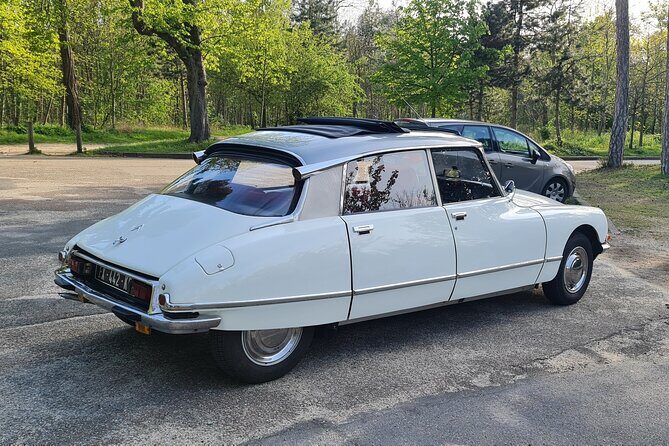 Paris City Tour 2h00 Citroën DS Vintage with Open Roof - Louvre area, Place Vendôme, and Opera-area elegance in one sweep