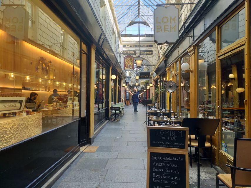 Paris: Covered Passages Walking Tour - Passage Choiseul: Sunlit Shops, 600+ Feet of Glass Roof, and Tiled-Floor Details