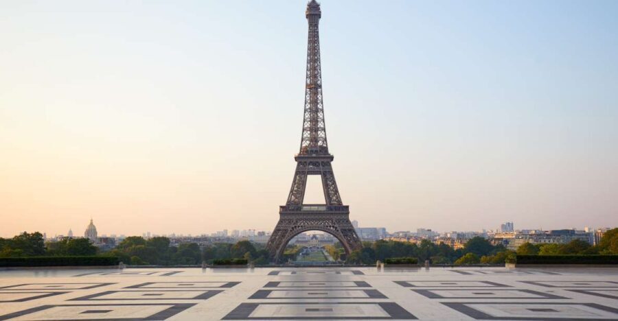 Paris: Eiffel Tower Summit Access Tour and River Cruise - The short host walk: learning the tower story while you get oriented