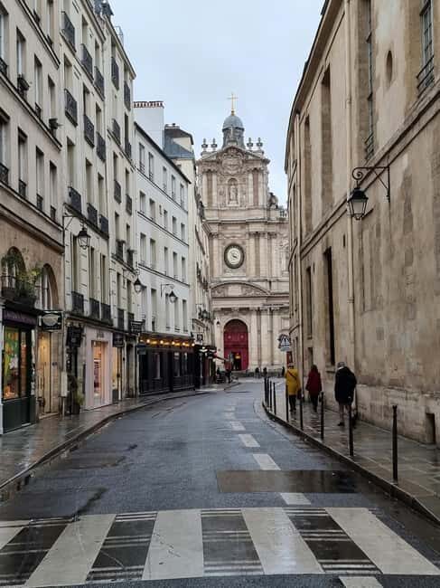 Paris Le Marais Food Tour: Full Traditional French Feast - Place des Vosges: seated main course, cheese choices, and choux