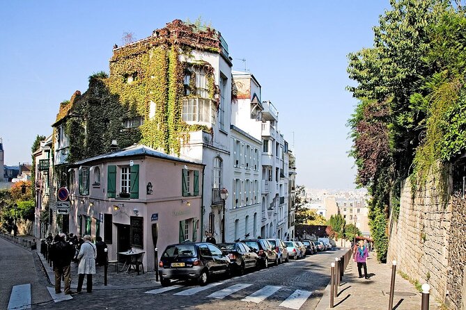 Paris Montmartre Private Walking Tour - Best Art, Culture, Food - Surreal humor: the man walking through a wall