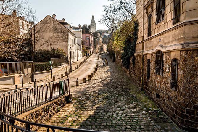 Paris Montmartre Private Walking Tour - Best Art, Culture, Food - Dalida’s bronze bust, the pink café house, and quiet fame