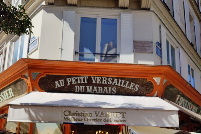 Private Full Day Paris trip including Louvre and Versailles with Pickup - Le Marais walking block: cobblestones, boutiques, and an optional switch