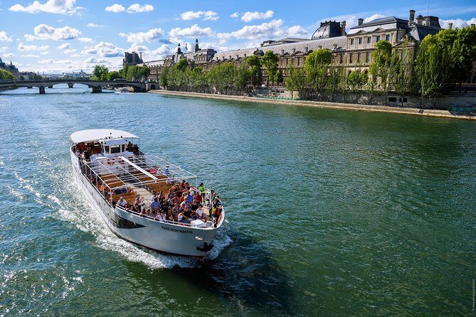 Seine River Guided Cruise Champagne Option by Vedettes de Paris - Conciergerie, the Louvre, and Place de la Concorde from the waterline