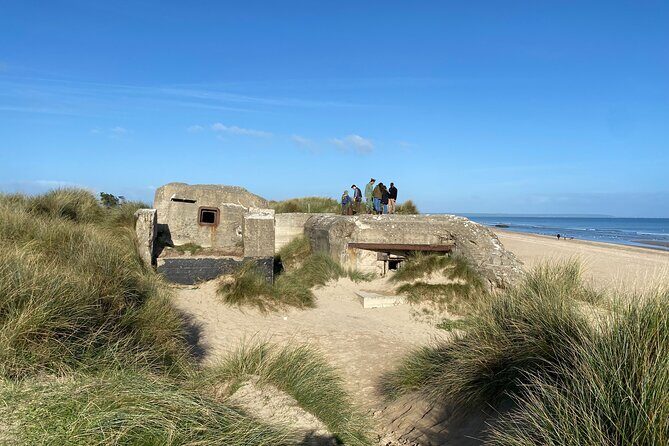 WW II Private Guided Tour American Landing Beaches in Normandy - Pointe du Hoc: following Ranger tracks up the 100-foot cliffs